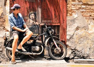 Boy on motorcycle street art Penang