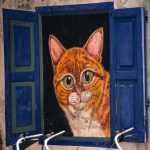 cat looking out of window street art mural Penang