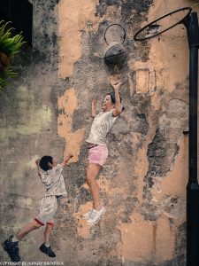 children playing basketball street art mural Penang