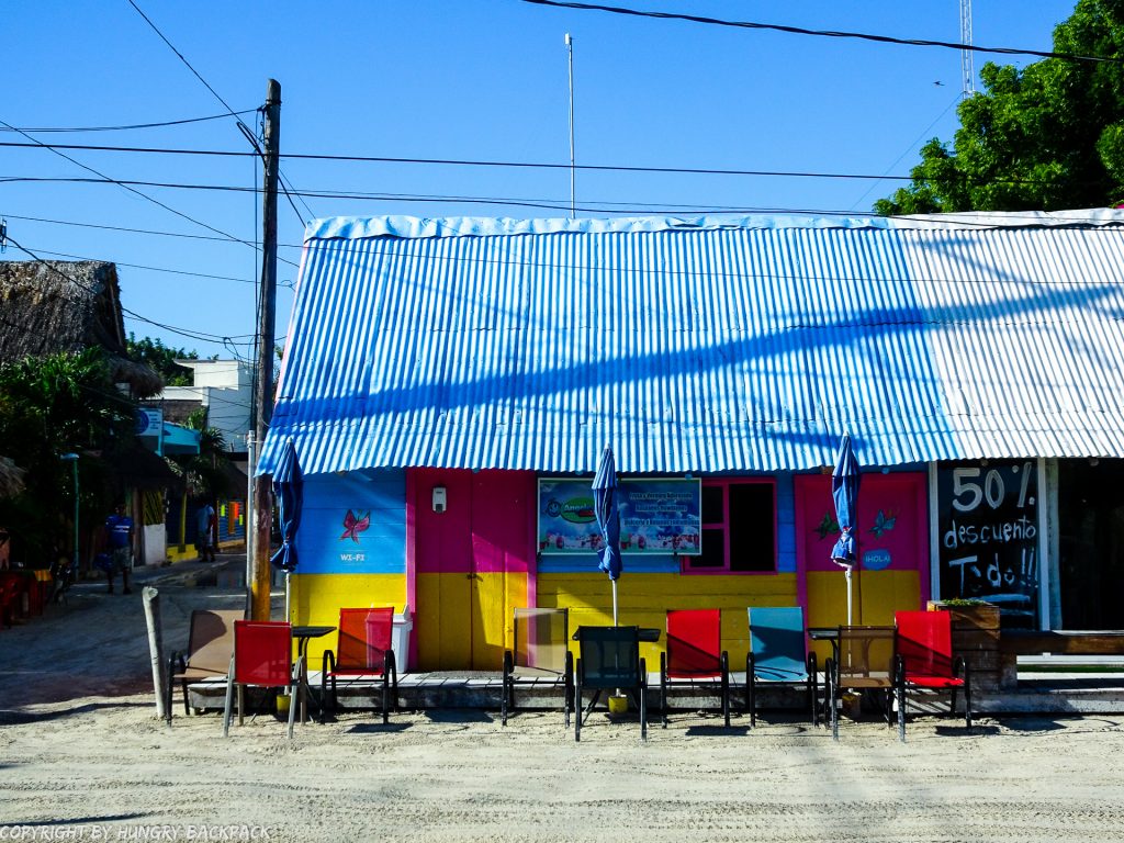 Explore Holbox on a budget_colourful cafe at central square