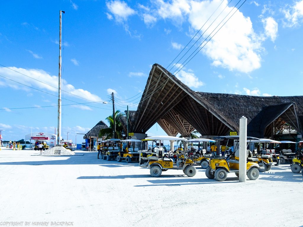 Guide to Holbox_getting around_golf cart taxis waiting at ferry terminal