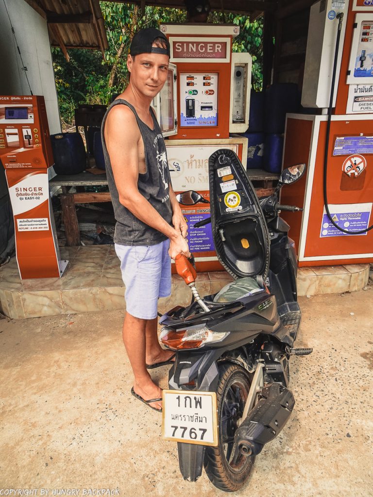 Guide-Ko-Kut_driving-scooter_local-gas-pump