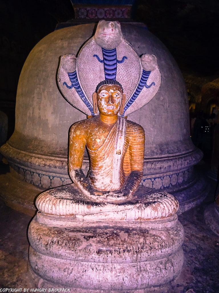 Dambulla things to do_Dambulla Cave Temple_sitting Buddha with snakes