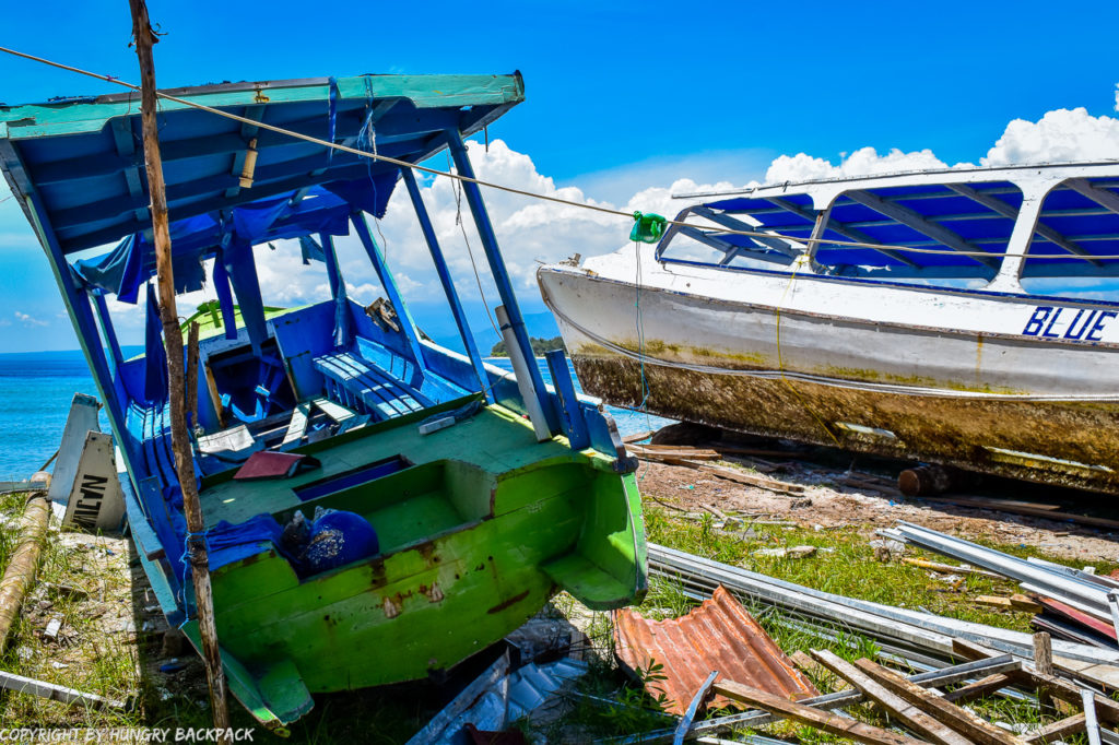 Gili Trawangan on year after earthquake_damaged tour boats at beach