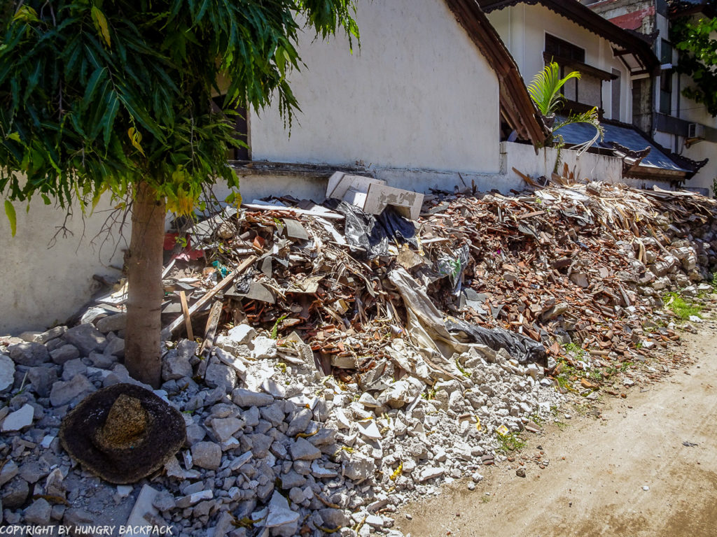 ili Trawangan on year after earthquake_pile of depris and rubble of collapsed buildings