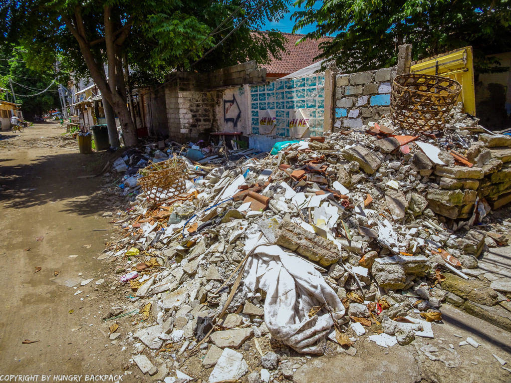 Gili Trawangan on year after earthquake_street with pile of depris and rubble of collapsed buildings