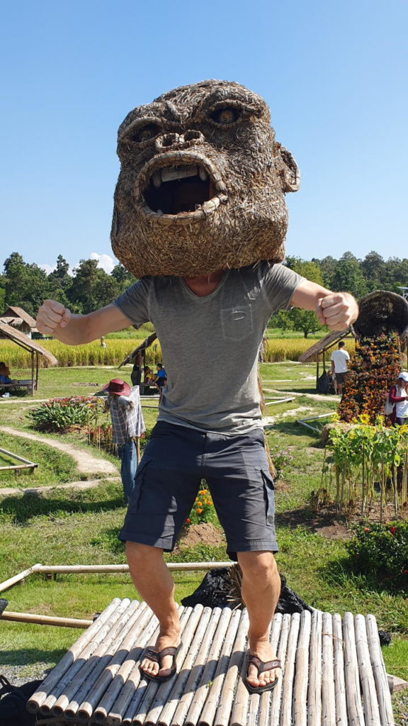 Martin trying on one of the big ape heads at the King Kong village
